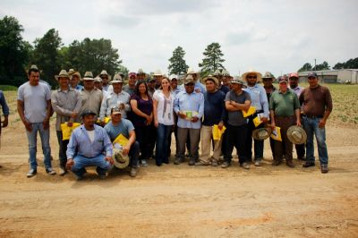 Secretary Massieu with workers.jpg